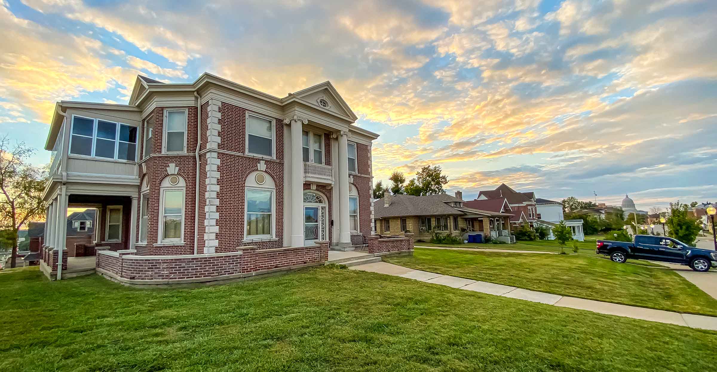 Parker's Place, a historic red-brick home in downtown Jefferson City, MO, at sunset
